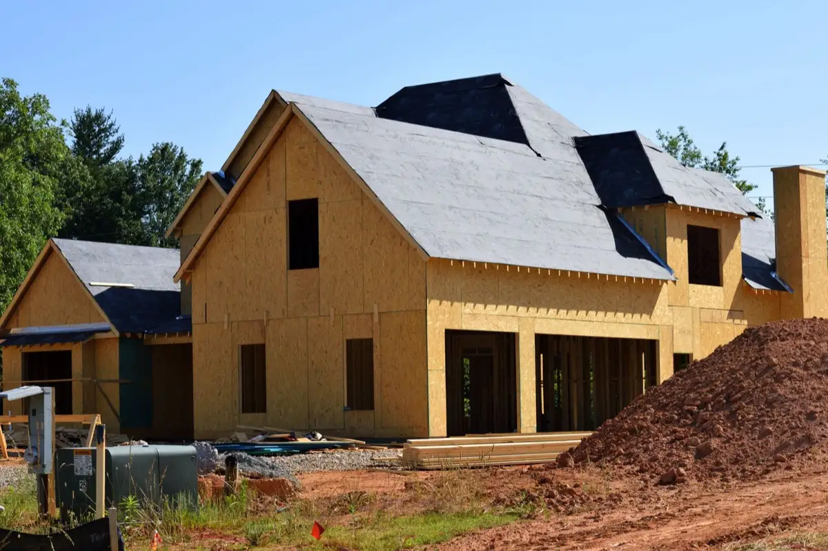 House with new roof decking and synthetic underlayment during a roof replacement in Raleigh, NC